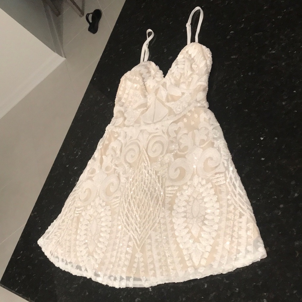 XS Mini Dress by Superdown.  No tags, never worn. Beautiful beaded mini dress!